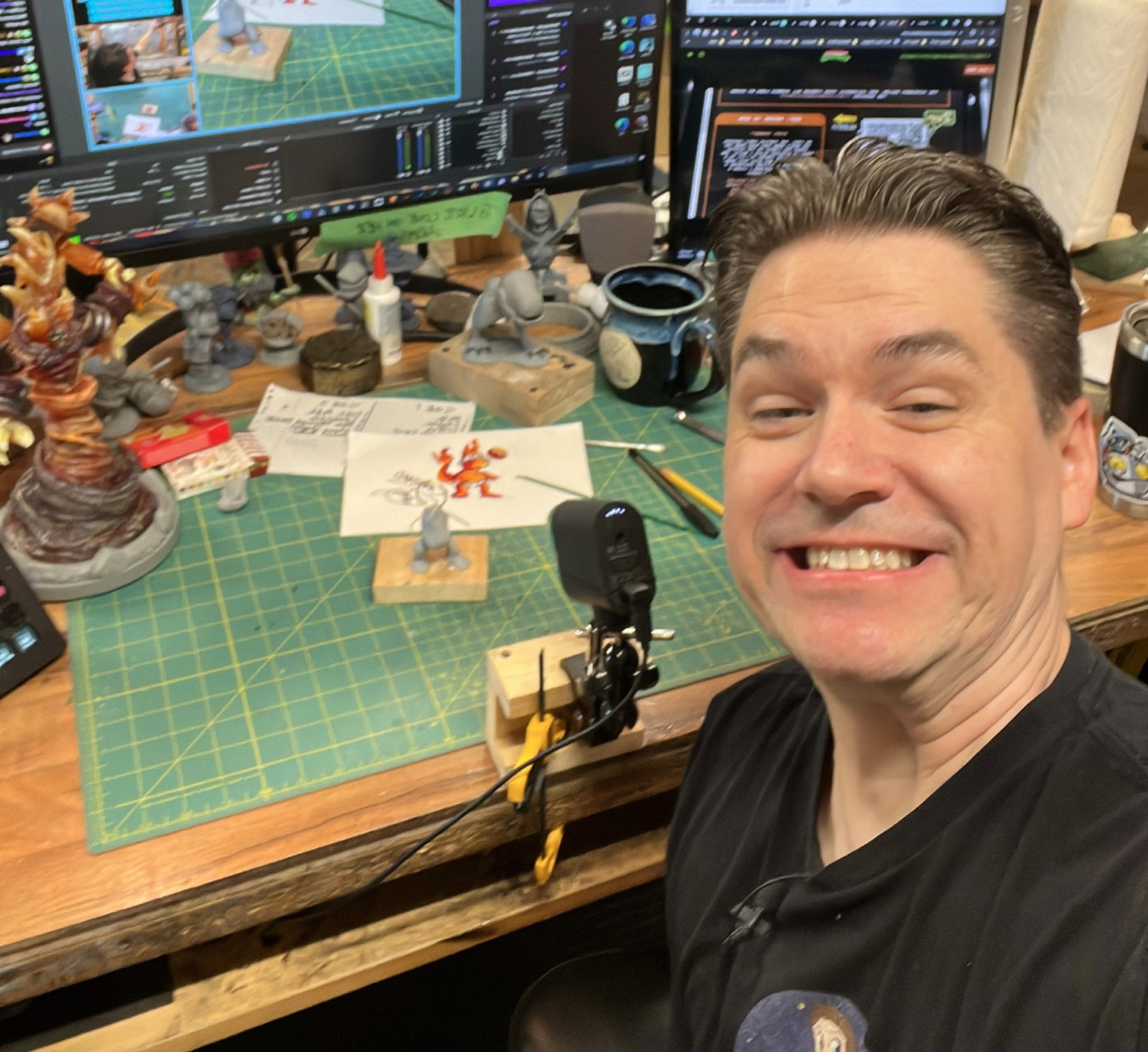 Paul Pape in his studio with props and sculptures